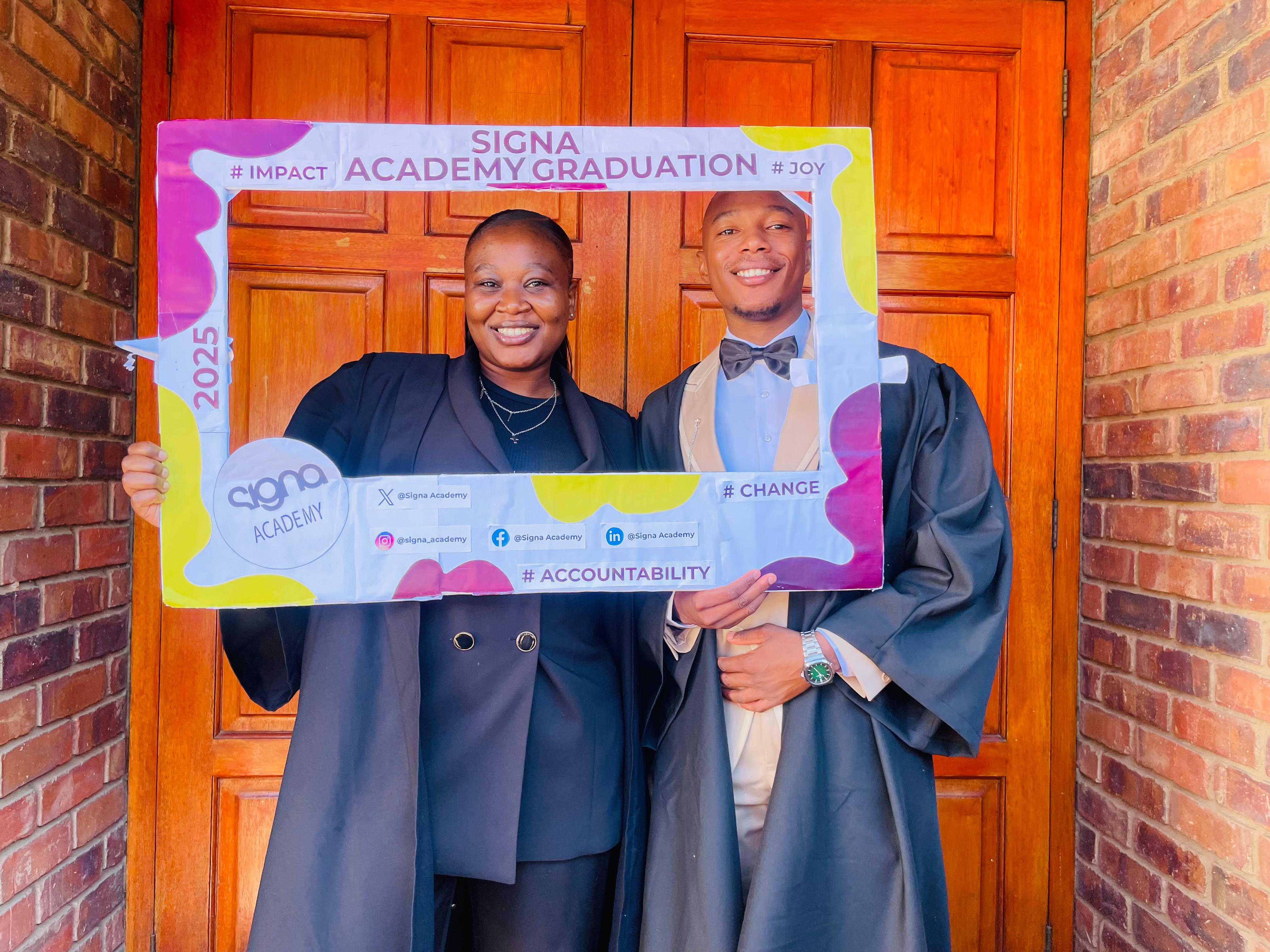 Two learners at mineware with their diplomas